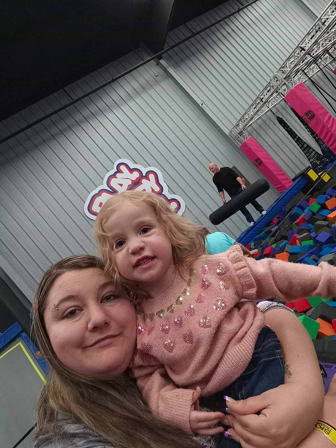 Willow is registered to the contest to win money with this photo: child, event, eyewear, fashion_accessory, fun, gesture, grass, happy, joy, laugh, leisure, magenta, party, person, pink, purple, recreation, sitting, skin, smile