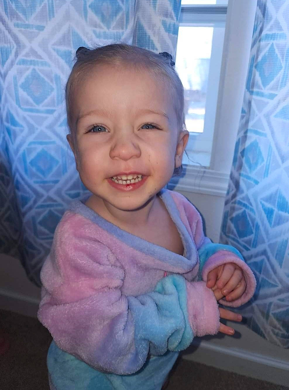 Willow is registered to the contest to win money with this photo: baby_toddler_clothing, cheek, chin, eye, eyebrow, face, facial_expression, gesture, happy, head, human_body, iris, mouth, nose, person, pink, purple, skin, sleeve, smile