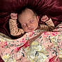 Breckilynn joined the competition — help win amazing prizes! baby, newborn, sleeping, blanket, floral, pink, yellow, face, arms, hands, bed, fabric, soft, cute, peaceful, infant, portrait, satin, texture, rest
