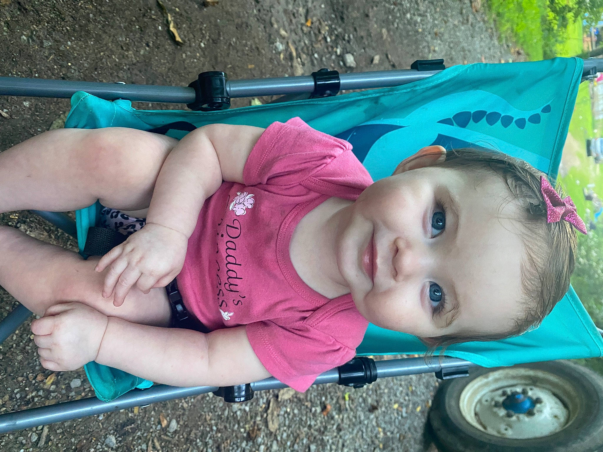 Alayah is registered to the contest to win money with this photo: automotive_tire, baby, baby_toddler_clothing, beauty, child, electric_blue, eye, fun, grass, green, human_body, leisure, people, person, pink, plant, product, smile, snapshot, toddler