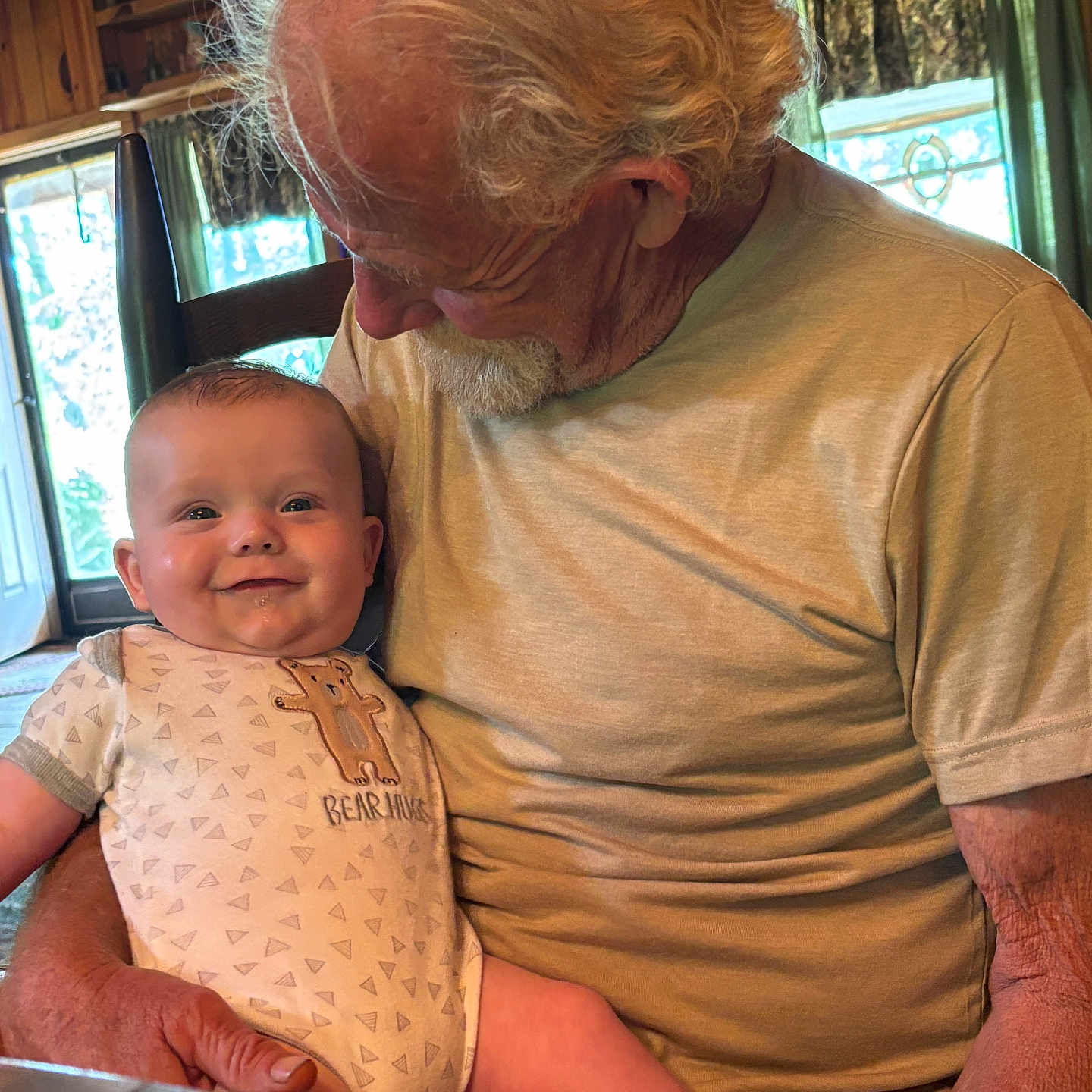 Augustas is registered to the contest to win money with this photo: accessories, adult, baby, blouse, clothing, couch, face, furniture, hardwood, head, male, man, newborn, person, photography, plywood, portrait, sitting, t_shirt, wood