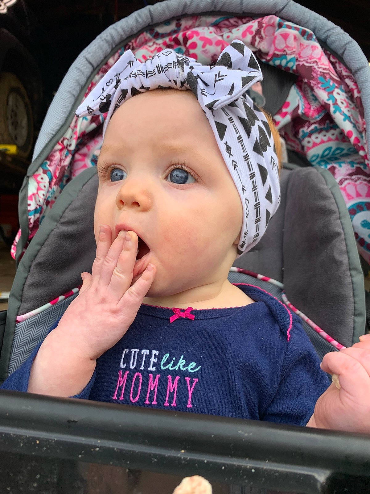 Charleigh is registered to the contest to win money with this photo: baby, baby_carriage, baby_products, car_seat, cheek, child, eye, face, finger, forehead, hair_accessory, head, headgear, headwear, lip, mouth, nose, person, pink, product