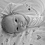 baby, baby_girl, black_and_white, blanket, child, closeup, cute, eyes, face, heart_pattern, infant, lying_down, monochrome, newborn, onesie, peaceful, portrait, sleepwear, soft_texture, toddler