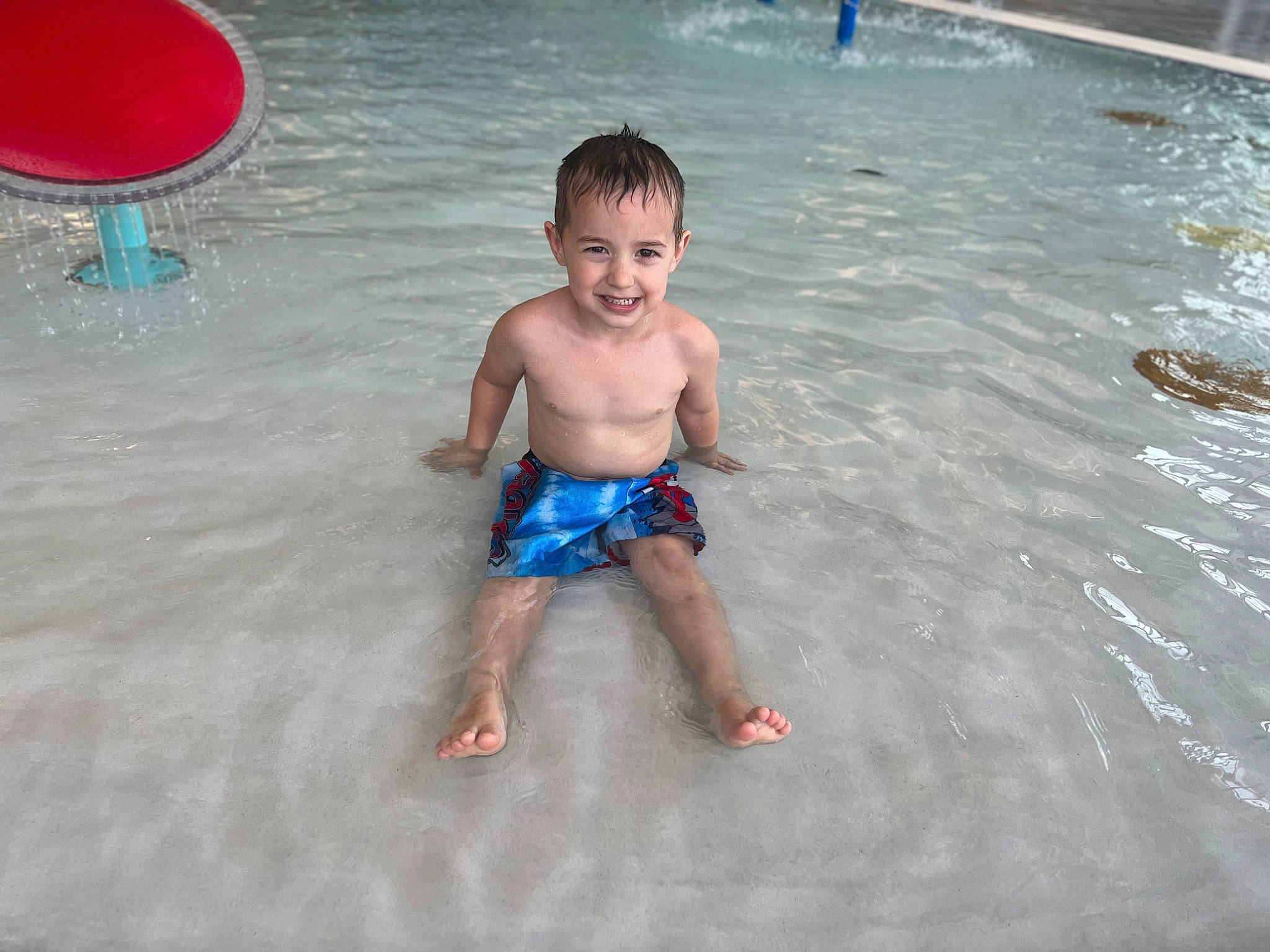 Atlas is registered to the contest to win money with this photo: baby, barechested, barefoot, bathing, chest, child, fluid, foot, fun, happy, joy, leisure, nonbuilding_structure, person, photograph, play, recreation, smile, summer, swimming_pool