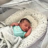 Yosiah is registered to the contest to win money with this photo: newborn, baby, sleeping, blanket, baby_nest, onesie, face, infant, cozy, soft, mesh_canopy, patterned, star, cute, peaceful, indoors, resting, child, portrait, sleep