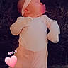 adorable, baby, blanket, child, cozy, cute, flower, headband, indoors, infant, lying_down, newborn, pacifier, peaceful, pink_clothing, resting, sleeping, soft_texture, warm_colors, white_clothing