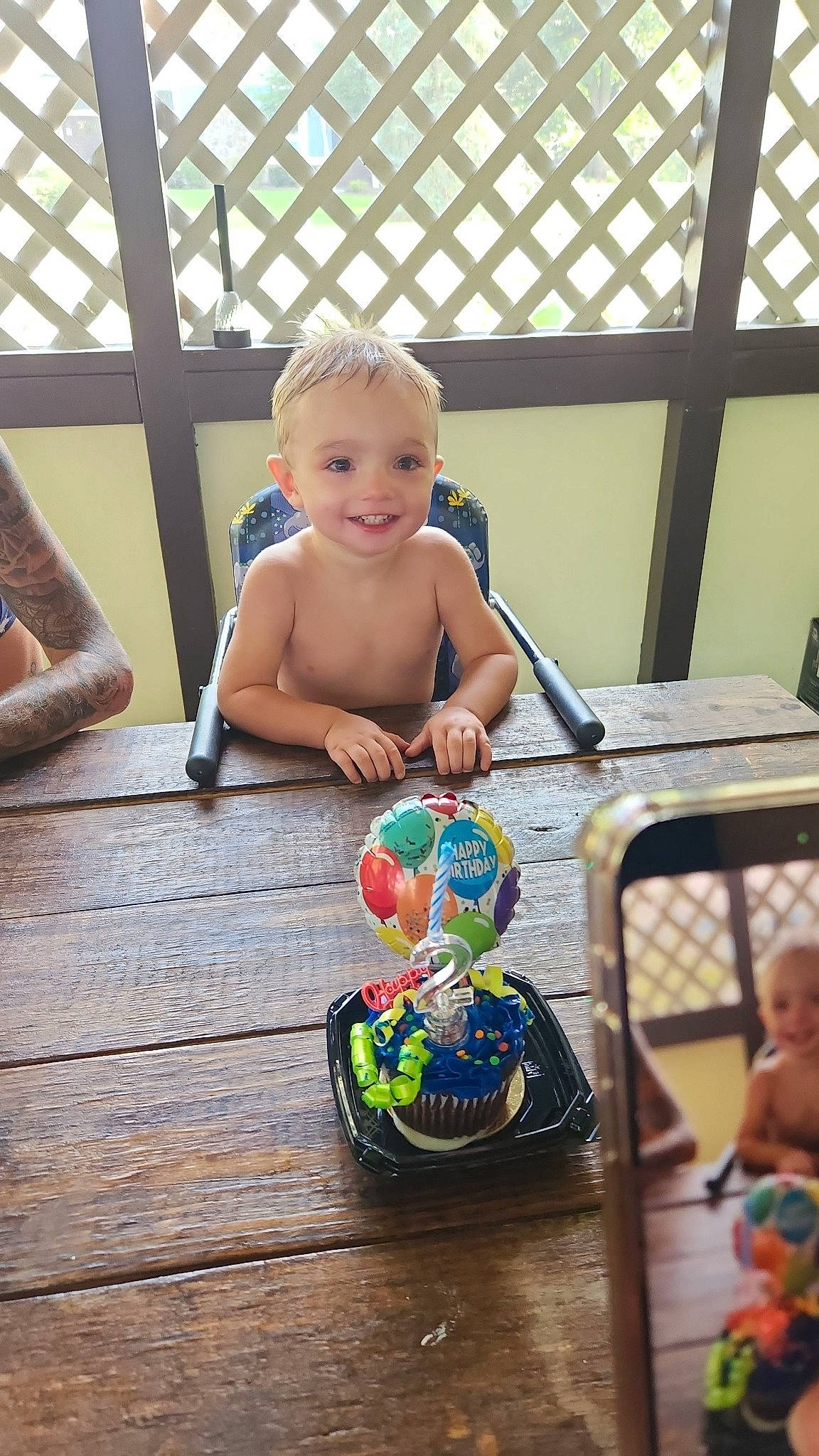 Maverick is registered to the contest to win money with this photo: baby, baby_products, baby_toddler_clothing, child, event, face, facial_expression, flooring, fun, grass, happy, hardwood, joy, leisure, person, recreation, sitting, smile, toddler, toy