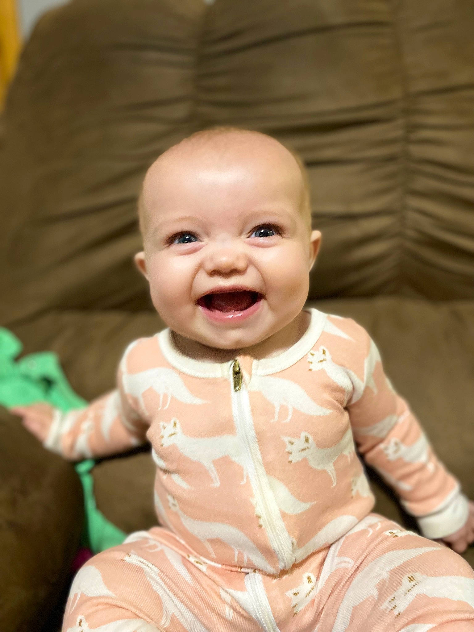 Huntley is registered to the contest to win money with this photo: baby, baby_products, baby_toddler_clothing, cheek, child, doll, eye, fun, gesture, happy, head, joy, peach, person, pink, room, sitting, skin, smile, toddler