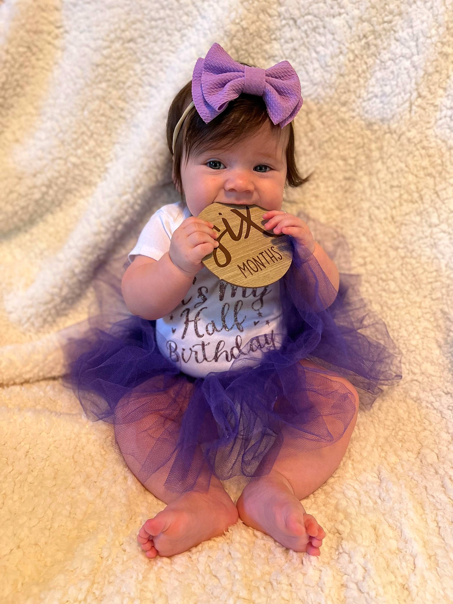 Rae Leigh is registered to the contest to win money with this photo: baby, baby_toddler_clothing, barefoot, brown_hair, child, costume_hat, fashion_accessory, foot, fun, happy, hat, magenta, peach, person, pink, purple, sitting, sleeve, textile, toddler