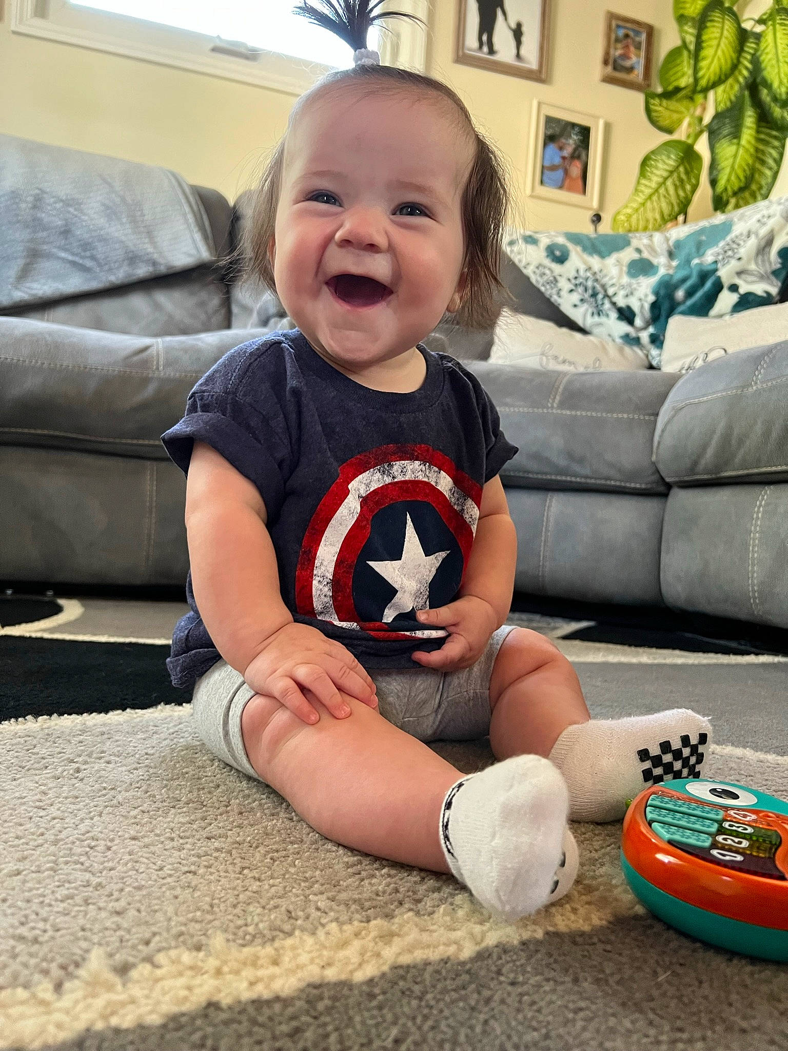 Rae Leigh joined the competition — help win amazing prizes! baby, baby_toddler_clothing, comfort, cool, couch, floor, flooring, fun, happy, knee, leg, mammal, people, person, picture_frame, skin, sleeve, smile, thigh, toddler
