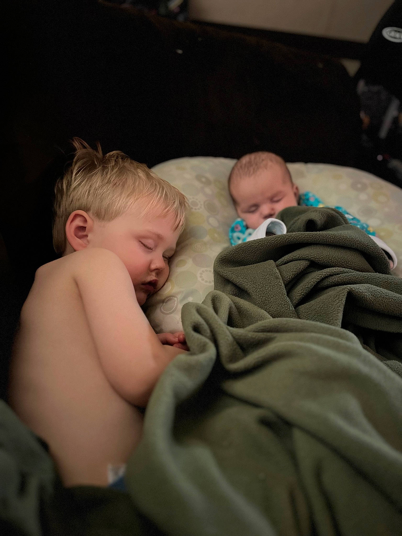 Oliver is registered to the contest to win money with this photo: abdomen, baby, bedtime, cheek, child, comfort, finger, fun, iris, linens, mammal, mouth, muscle, people, person, room, sitting, skin, toddler, trunk
