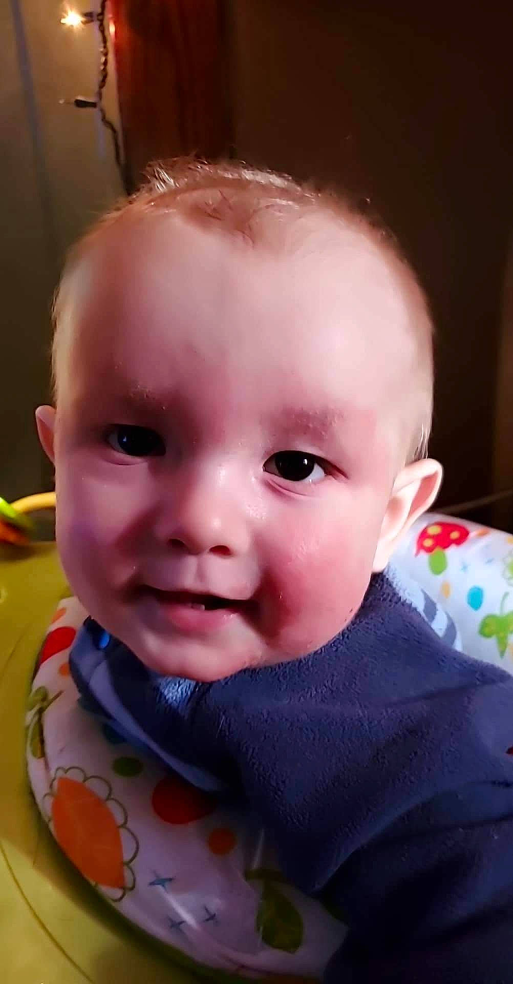 Devon is registered to the contest to win money with this photo: baby, baby_toddler_clothing, cheek, child, close_up, ear, eyebrow, eyelash, fun, happy, iris, lip, mouth, nose, person, pink, skin, sleeve, smile, toddler