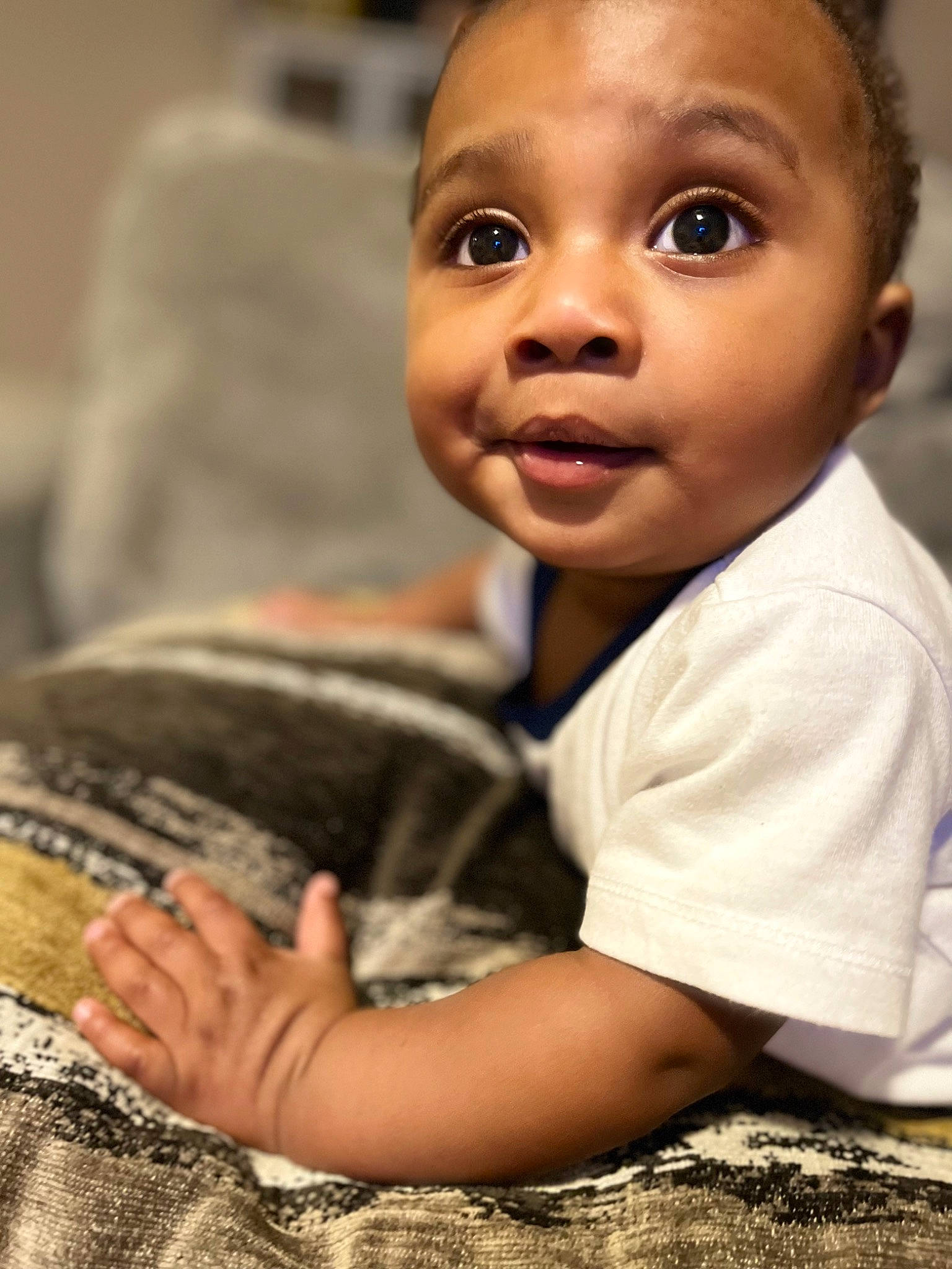 Messiah joined the competition — help win amazing prizes! arm, baby, cheek, child, comfort, facial_expression, fun, grass, happy, military_camouflage, nose, pattern, person, portrait_photography, room, sitting, skin, smile, soil, surprise