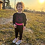 boy, child, clothing, face, footwear, grass, happy, head, male, pants, person, photography, plant, portrait, shoe, smile, sneaker, standing, sunlight, tree