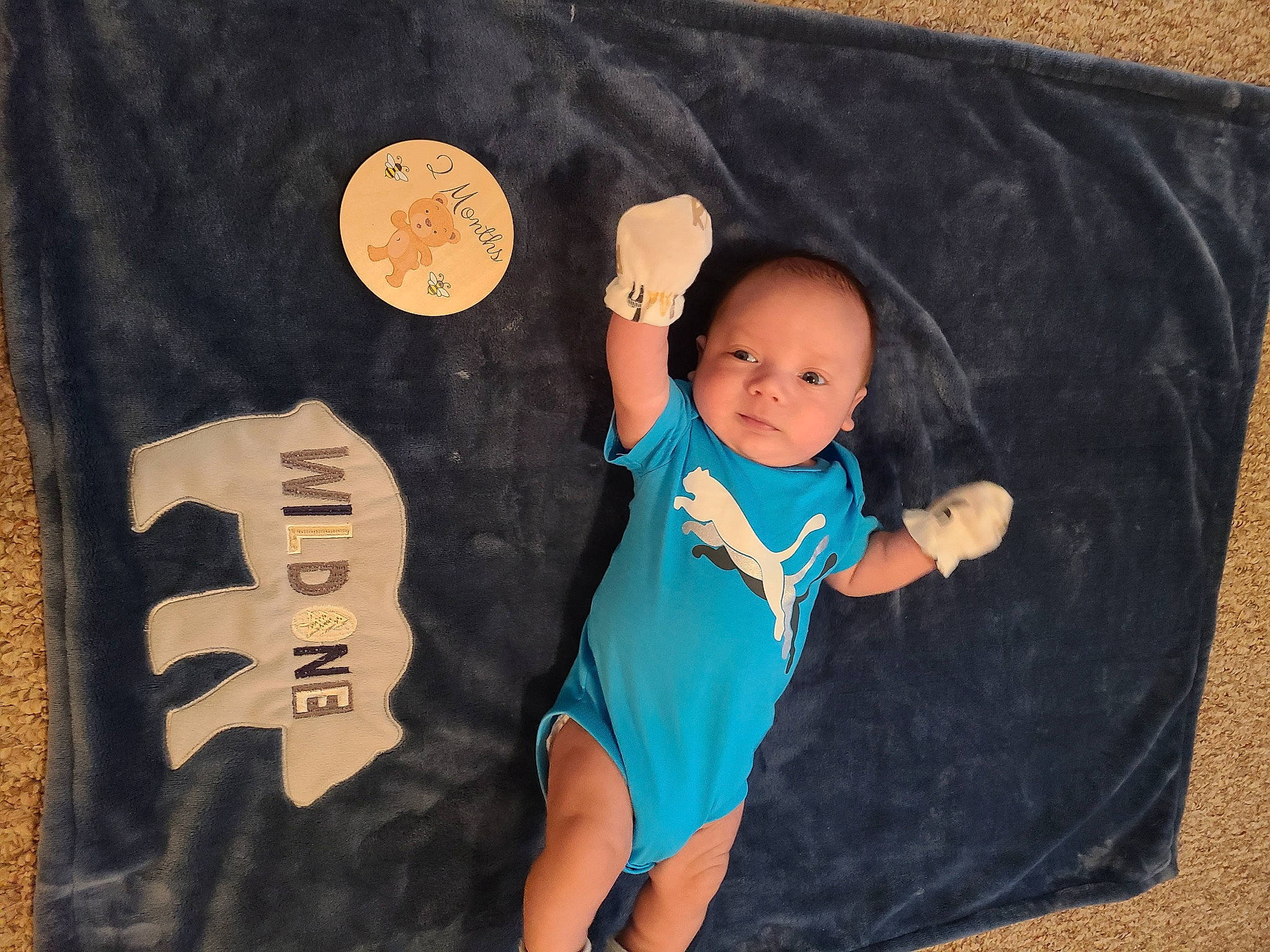 Dawson is registered to the contest to win money with this photo: arm, baby, baby_toddler_clothing, barefoot, child, electric_blue, finger, foot, happy, knee, mammal, pattern, person, room, sleeve, t_shirt, textile, thigh, thumb, toddler