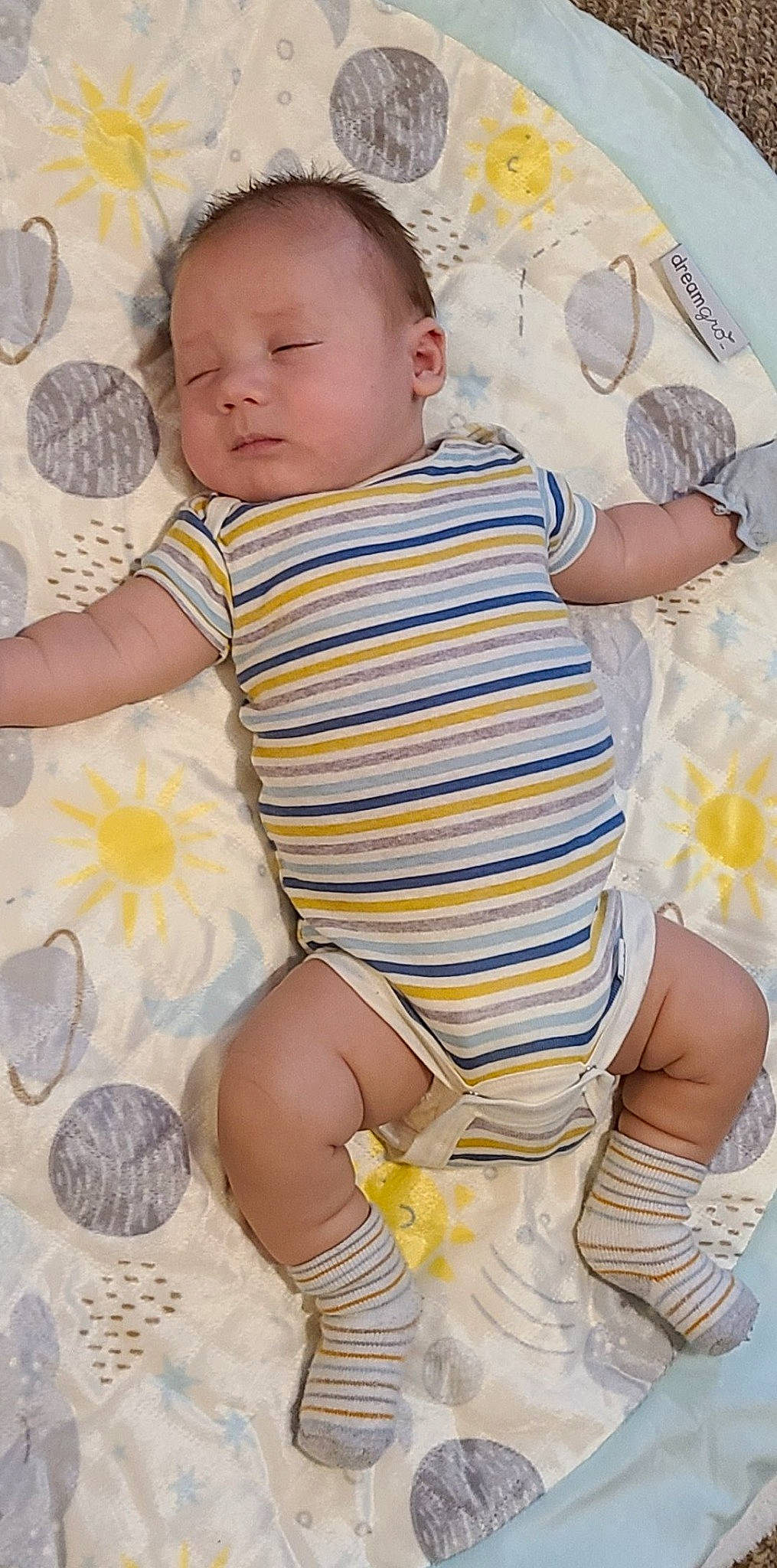 Dawson is registered to the contest to win money with this photo: arm, baby, baby_toddler_clothing, cheek, child, eye, face, facial_expression, finger, hand, iris, leg, person, pink, skin, sleeve, stomach, textile, thigh, toddler