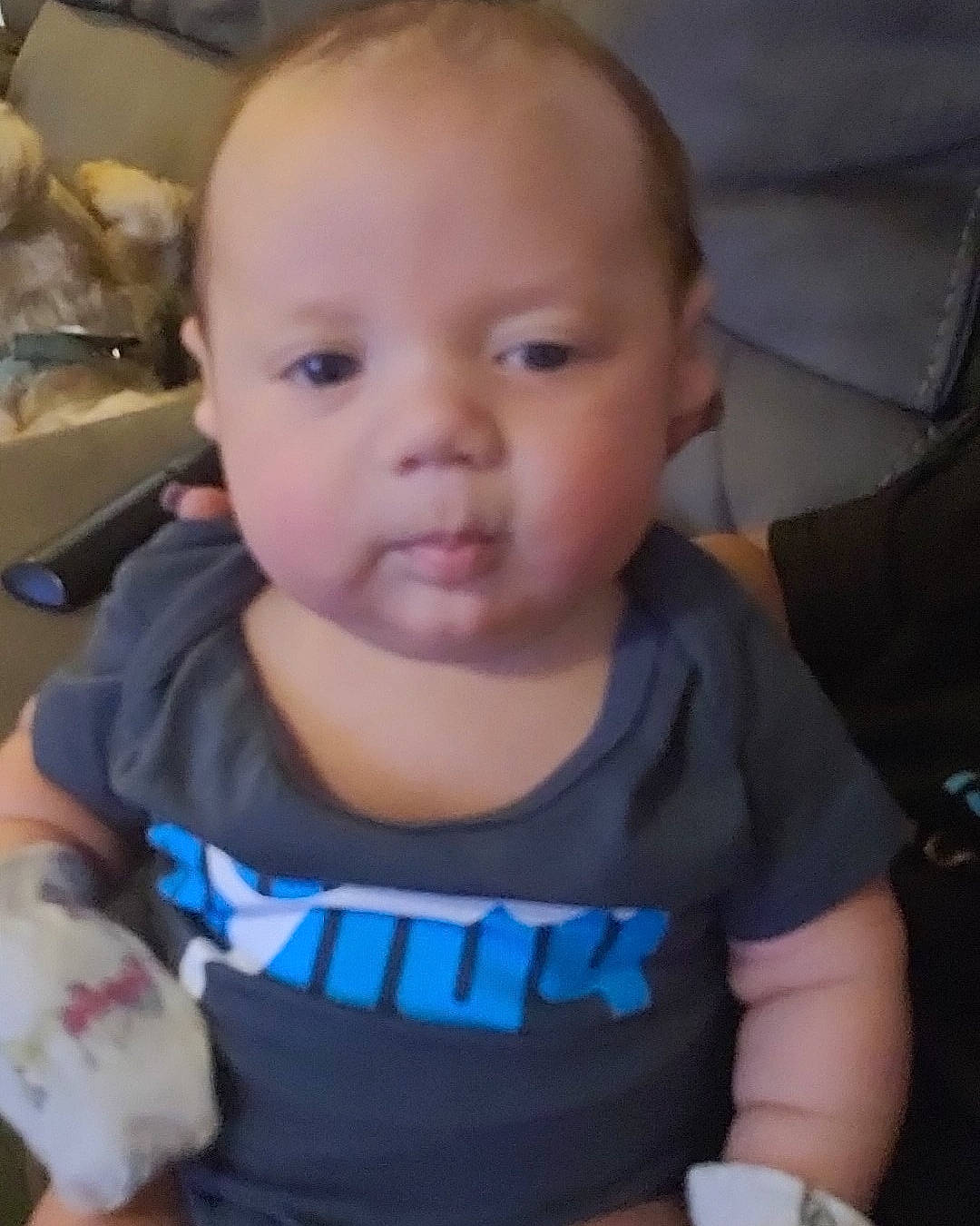 Dawson is registered to the contest to win money with this photo: arm, baby, baby_toddler_clothing, cheek, chin, ear, eye, eyebrow, finger, forehead, head, iris, lip, mouth, nose, person, skin, sleeve, t_shirt, thumb