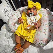Michelle joined the competition — help win amazing prizes! baby, bed, clothing, costume, couch, crib, cushion, dress, face, footwear, furniture, head, homedecor, indoors, infantbed, person, photography, portrait, sandal, shoe