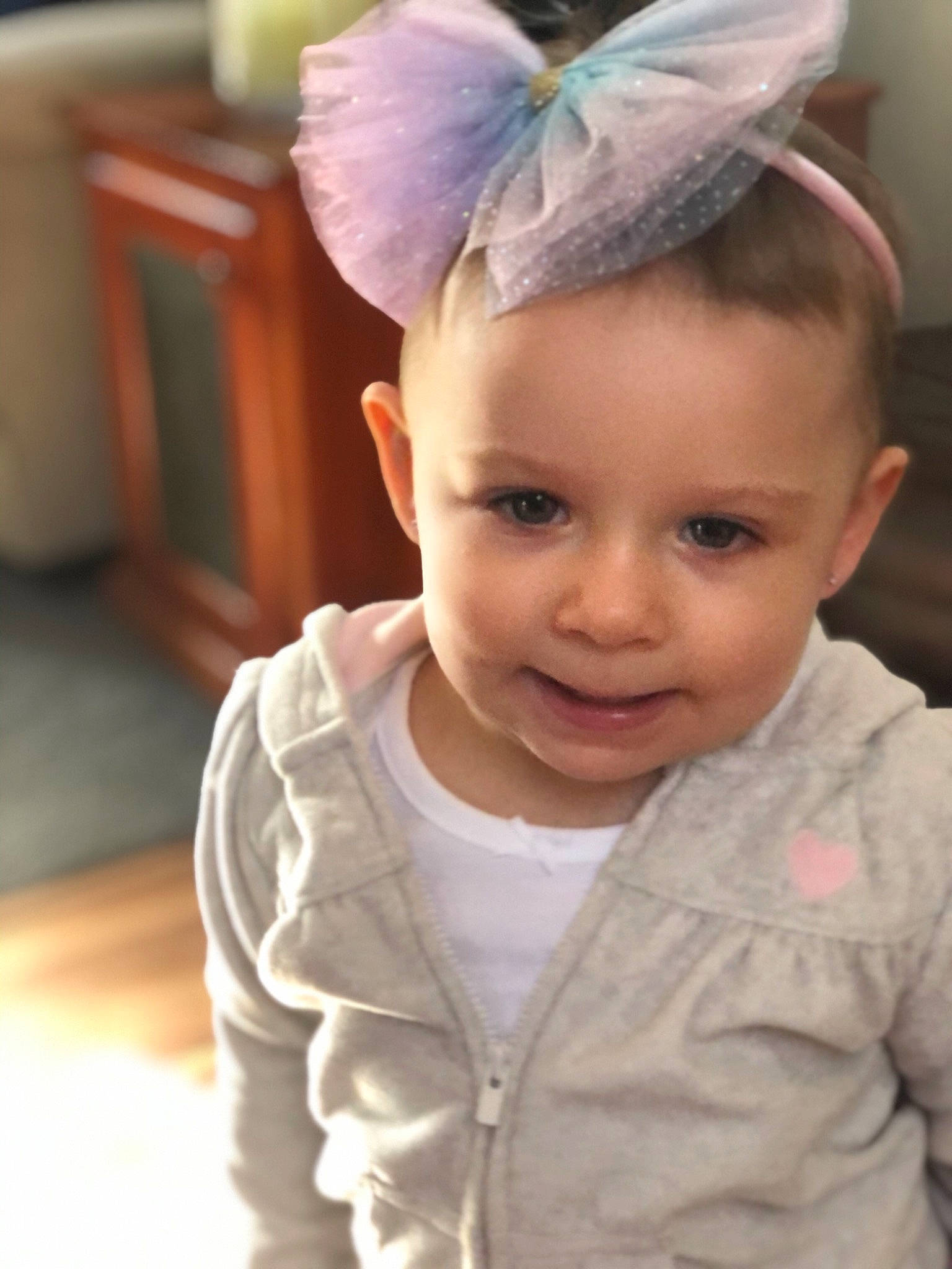 Adalaya is registered to the contest to win money with this photo: baby, baby_toddler_clothing, chin, costume_hat, dress, ear, eye, eyelash, happy, headpiece, helmet, human_body, iris, neck, outerwear, person, skin, sleeve, smile, toddler