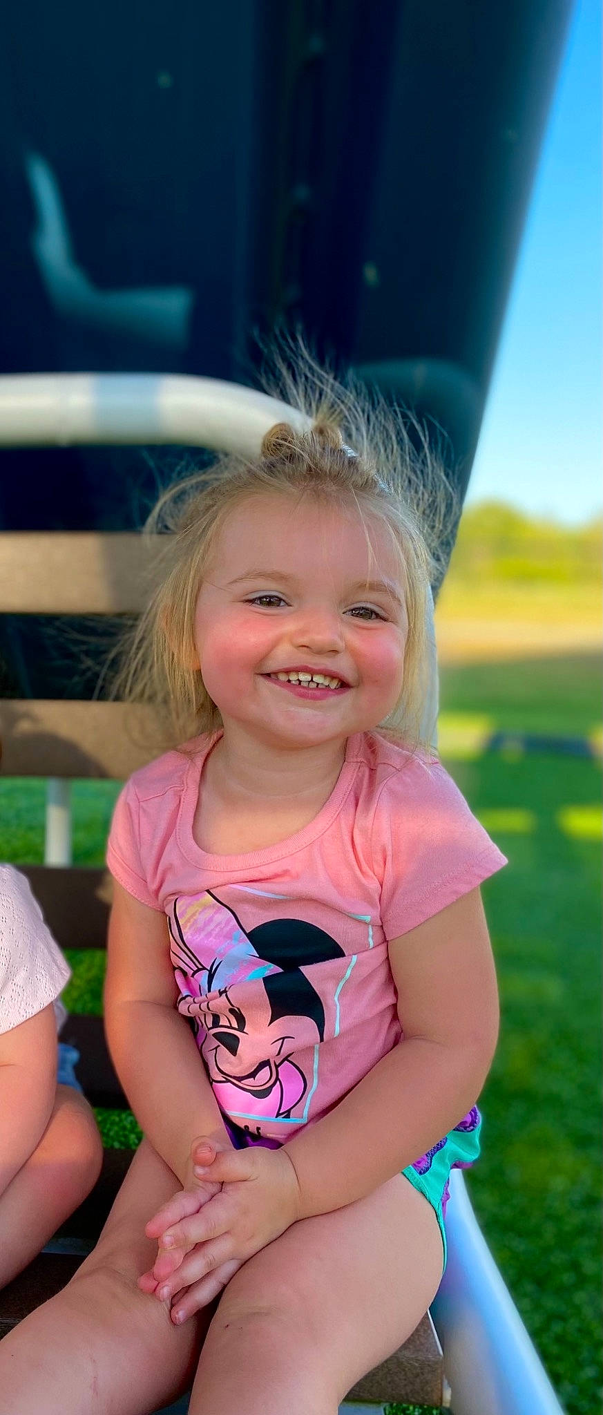 Ezmae is registered to the contest to win money with this photo: baby_toddler_clothing, cool, eye, facial_expression, finger, fun, grass, hairstyle, happy, head, iris, joy, leisure, mammal, mouth, person, pink, skin, smile, summer