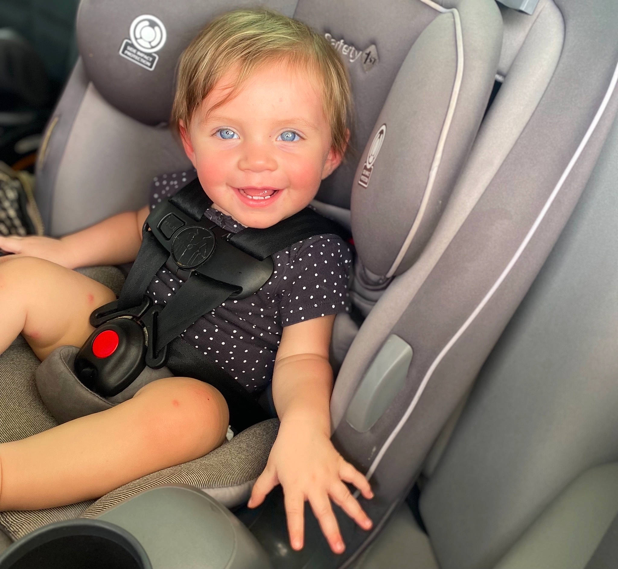 Norah is registered to the contest to win money with this photo: auto_part, automotive_design, car, car_seat, car_seat_cover, child, comfort, family_car, flash_photography, head_restraint, joy, luxury_vehicle, motor_vehicle, person, product, smile, steering_part, steering_wheel, thigh, toddler