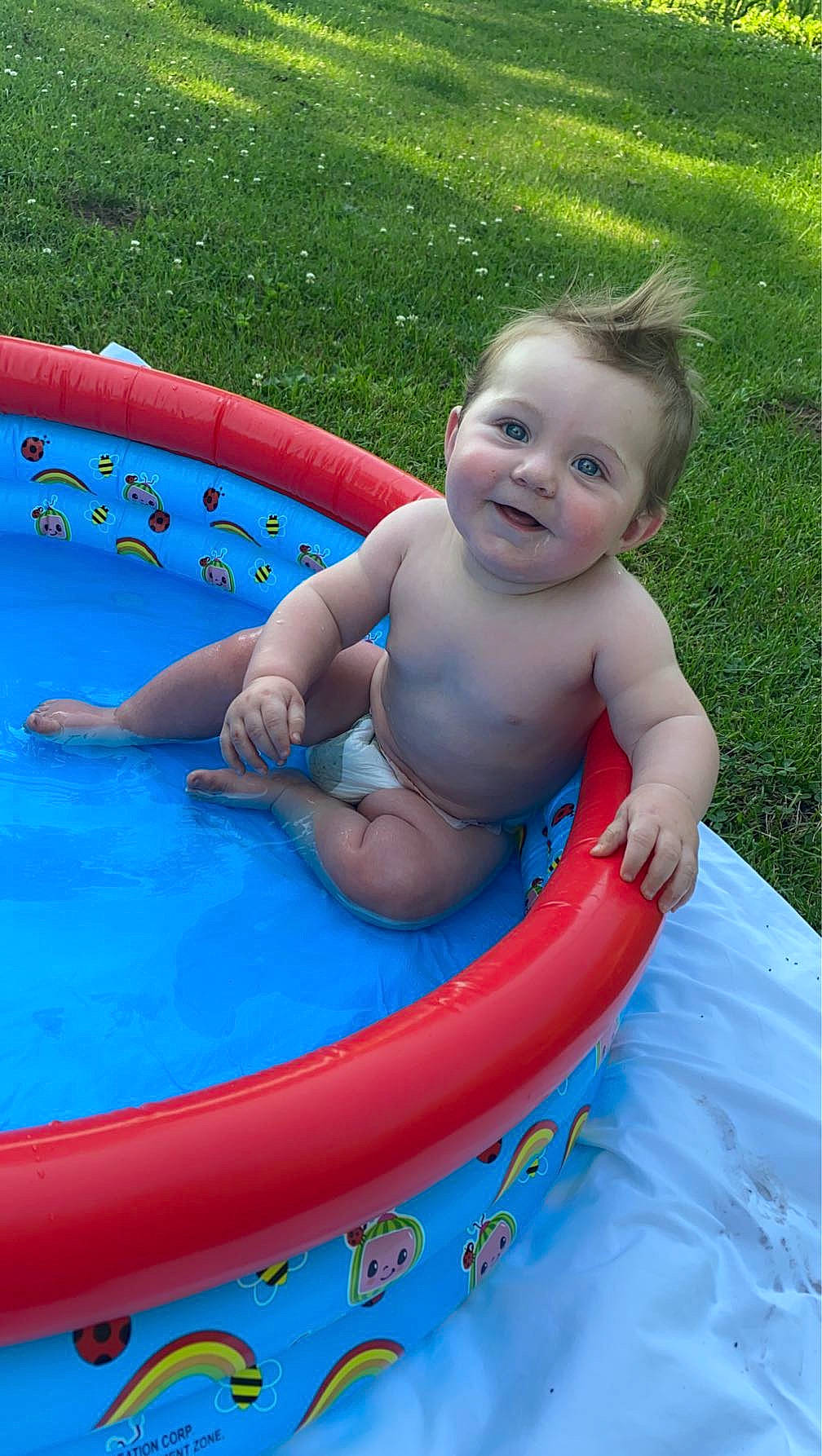 Daylan is registered to the contest to win money with this photo: aqua, baby, baby_bathing, baby_products, bathing, child, fun, games, grass, happy, inflatable, joy, leisure, nonbuilding_structure, person, play, product, recreation, sitting, smile
