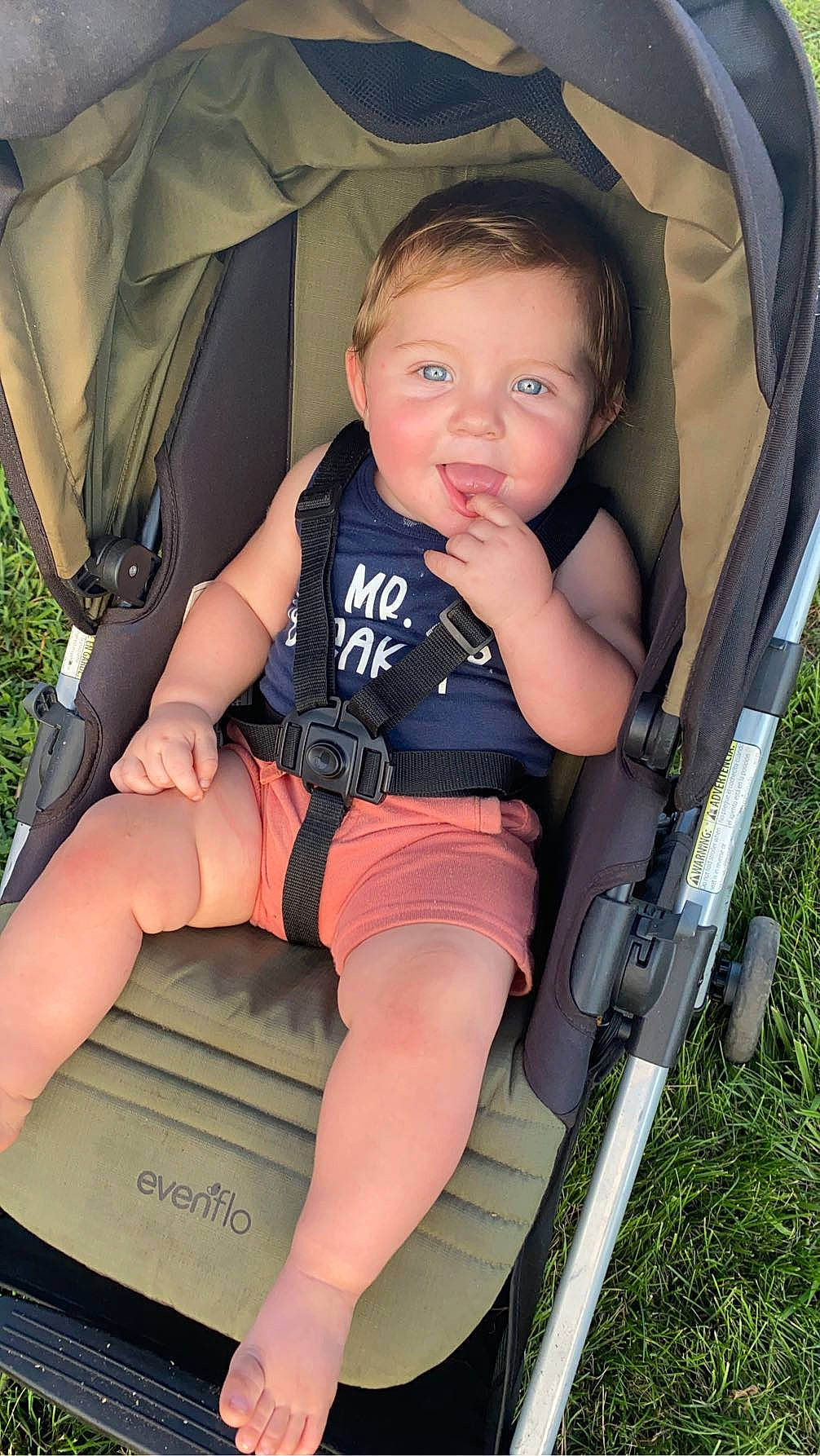 Daylan is registered to the contest to win money with this photo: baby, baby_carriage, baby_products, chair, comfort, fun, grass, hand, human_body, human_leg, knee, lap, leg, leisure, person, recreation, shorts, sitting, skin, thigh