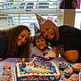 Melani Rodriguez is registered to the contest to win money with this photo: birthday, child, party_hat, cake, cupcakes, family, smile, indoor, window, curtains, frozen_theme, table, celebration, happy, people, food, dessert, colorful, poster, toy