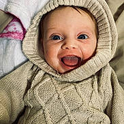 Raelynn joined the competition — help win amazing prizes! baby, child, smiling, hoodie, knitted, cozy, blue_eyes, happy, portrait, closeup, cute, infant, warm_clothing, blanket, indoors, soft_texture, person, toddler, face, expression
