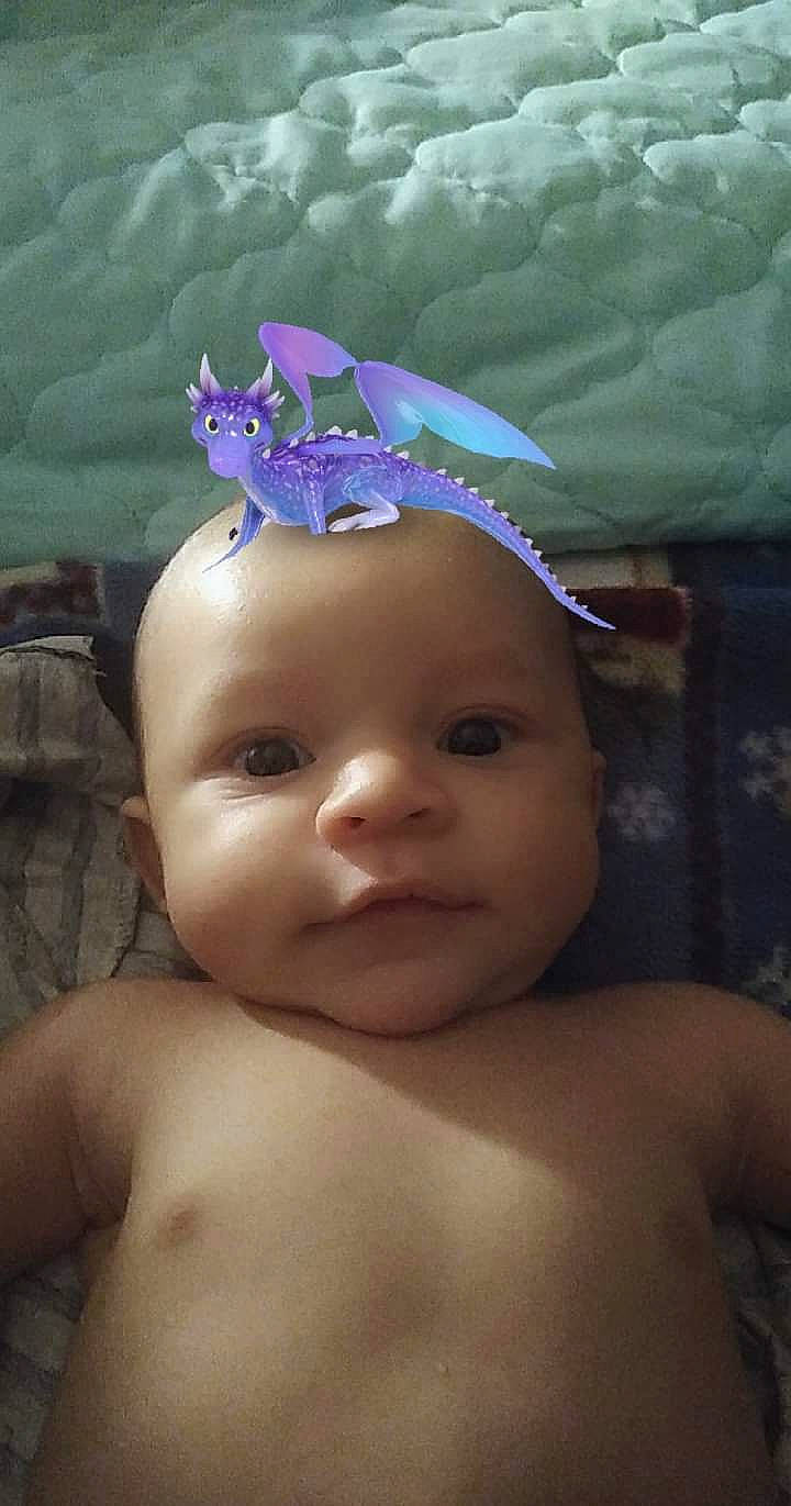 Osiris is registered to the contest to win money with this photo: baby, baby_toddler_clothing, cap, child, costume_hat, electric_blue, eye, eyebrow, fish, headgear, iris, lip, mammal, mouth, person, pink, purple, skin, toddler, toy