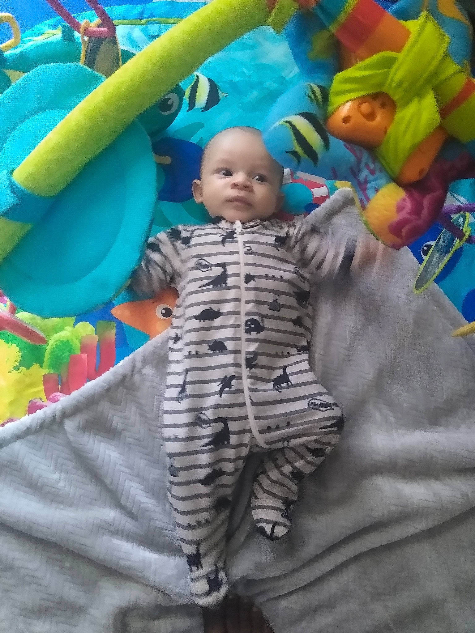 Osiris is registered to the contest to win money with this photo: baby, baby_products, baby_toddler_clothing, bed, bedding, blue, child, event, fun, green, happy, leisure, linens, person, play, recreation, room, stuffed_toy, t_shirt, textile