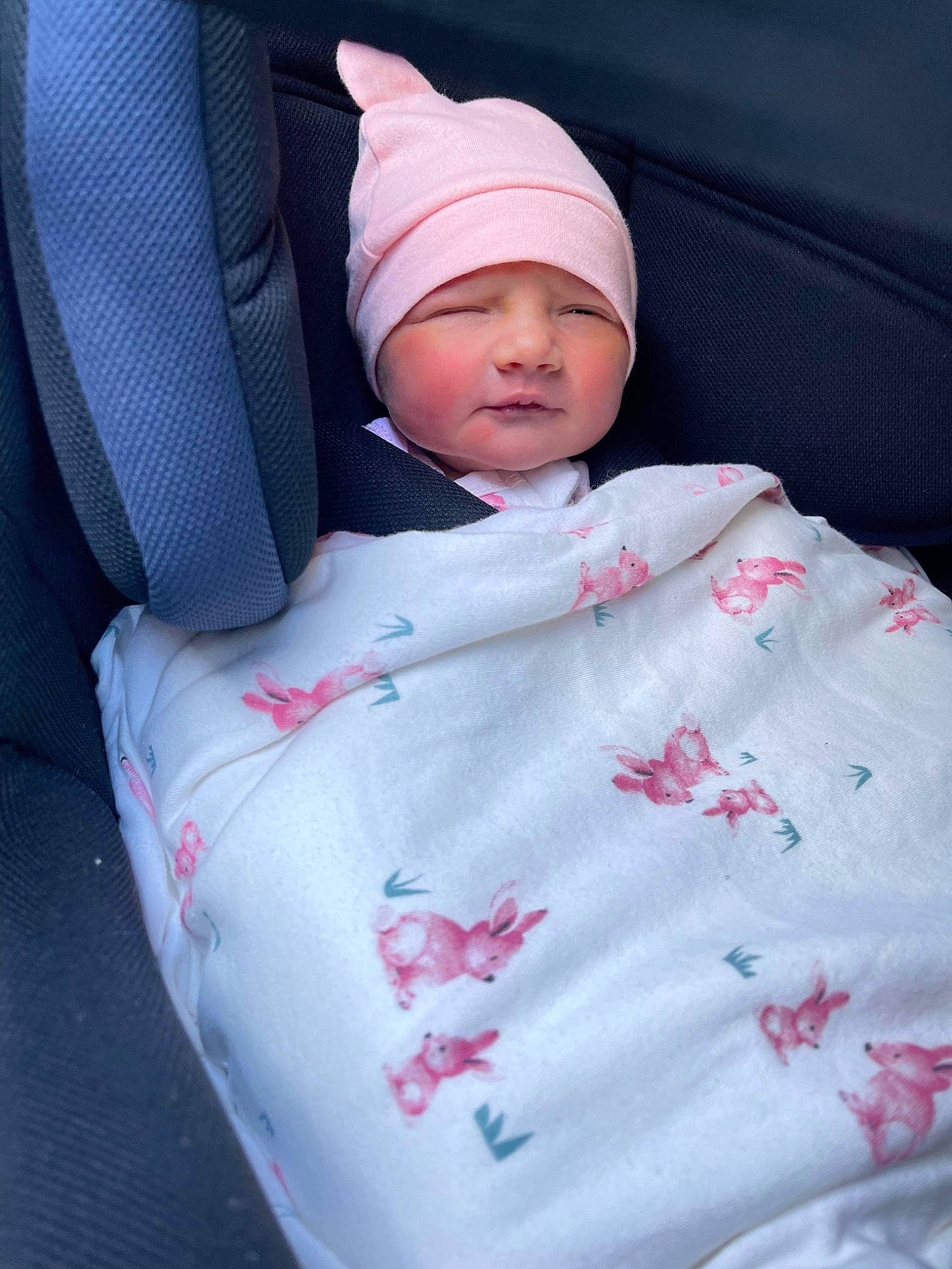 Evie is registered to the contest to win money with this photo: baby, baby_products, baby_safety, baby_sleeping, baby_toddler_clothing, bedding, cap, car_seat, carmine, child, comfort, headwear, linens, nap, pattern, person, pink, sitting, sleep, sleeve