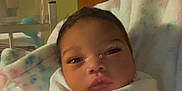 Celeste joined the competition — help win amazing prizes! newborn, baby, blanket, hospital, infant, swaddled, face, person, bed, wristband, soft_lighting, indoors, cute, sleepy, resting, hospital_room, hand, healthcare, newborn_baby, wrapped