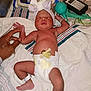 Celeste is registered to the contest to win money with this photo: newborn, baby, hospital, diaper, headband, medical_equipment, hand, bed, blanket, person, skin, infant, sleeping, cute, healthcare, wristband, umbilical_cord, comfort, care, rest