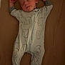 Lincoln is registered to the contest to win money with this photo: baby, sleeping, onesie, bear_pattern, blanket, infant, cozy, arms_up, footed_pajamas, peaceful, child, bedtime, cute, sleepwear, newborn, resting, soft, relaxing, indoors, portrait
