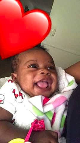 Anais is registered to the contest to win money with this photo: baby, baby_laughing, cheek, child, ear, face, facial_expression, forehead, fun, happy, head, headgear, laugh, lip, mouth, nose, person, pink, skin, smile