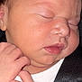 Alara Urtecho is registered to the contest to win money with this photo: baby, newborn, sleeping, close_up, face, hands, infant, skin, peaceful, soft, cute, child, portrait, resting, young, human, toddler, fingers, clothing, seatbelt