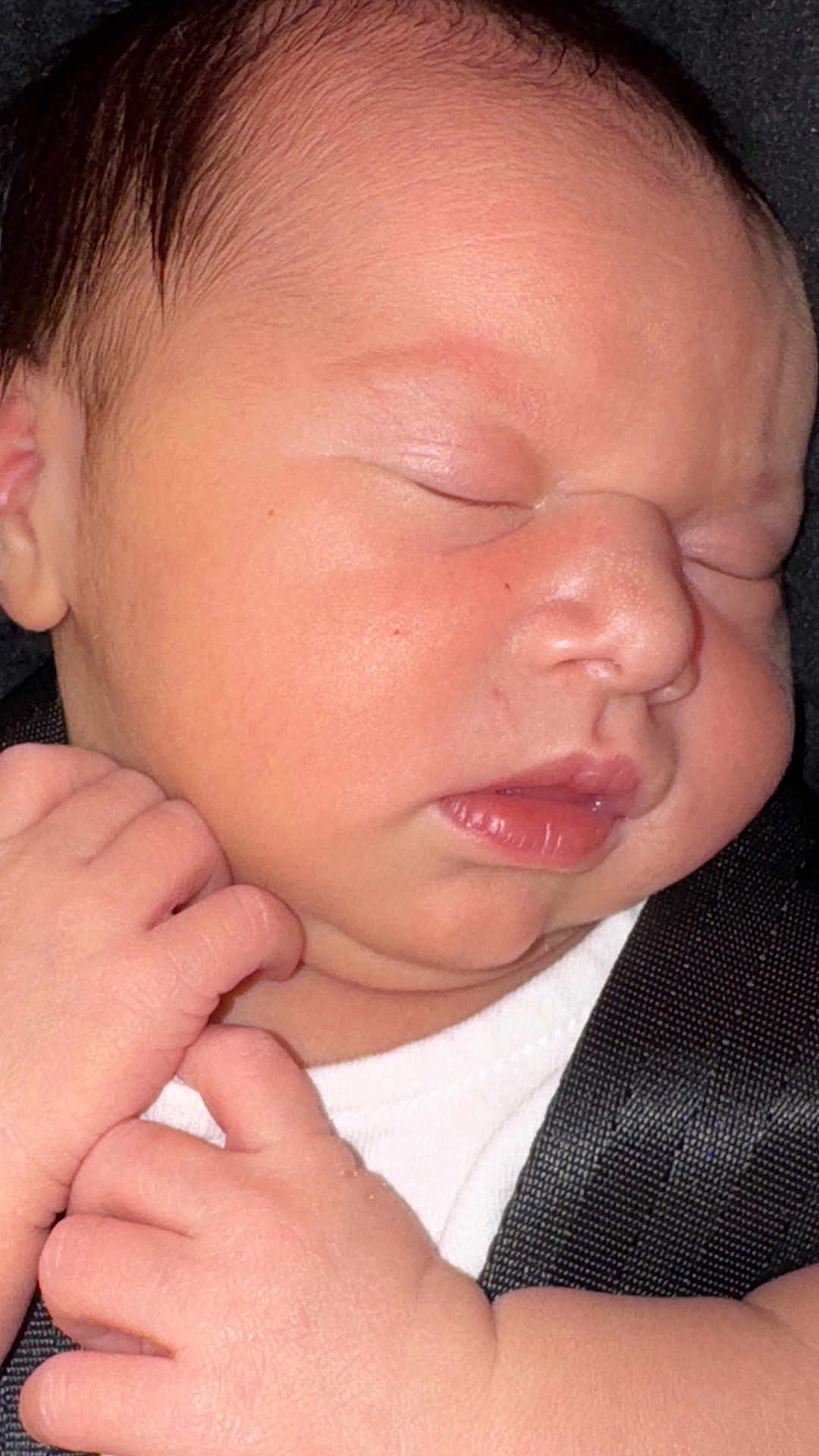 Alara Urtecho is registered to the contest to win money with this photo: baby, newborn, sleeping, close_up, face, hands, infant, skin, peaceful, soft, cute, child, portrait, resting, young, human, toddler, fingers, clothing, seatbelt