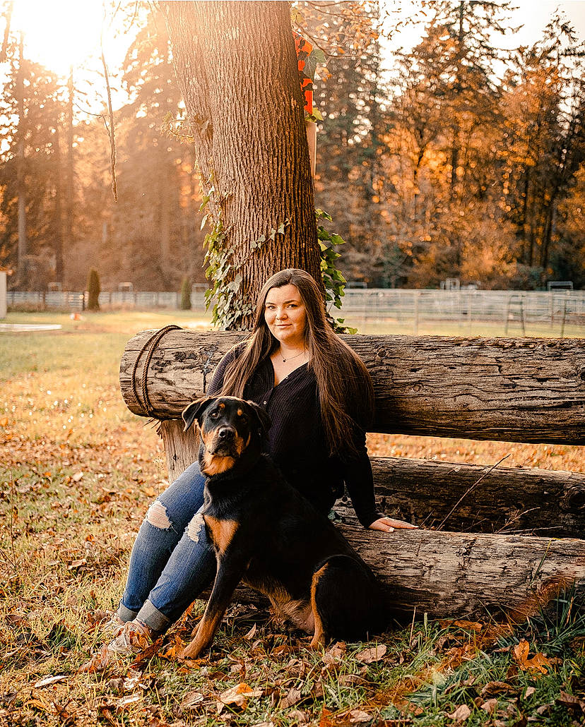 Koa is registered to the contest to win money with this photo: branch, carnivore, dog, eye, fawn, flash_photography, grass, happy, leg, light, mammal, people_in_nature, plant, smile, sunlight, tree, trunk, wood, woody_plant, yellow