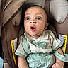 Mateo joined the competition — help win amazing prizes! baby, car_seat, child, surprised_expression, clothing, bow_tie, infant, seat_belt, fabric, person, cute, portrait, indoor, close_up, seat, young_child, head, skin, eyes, hands