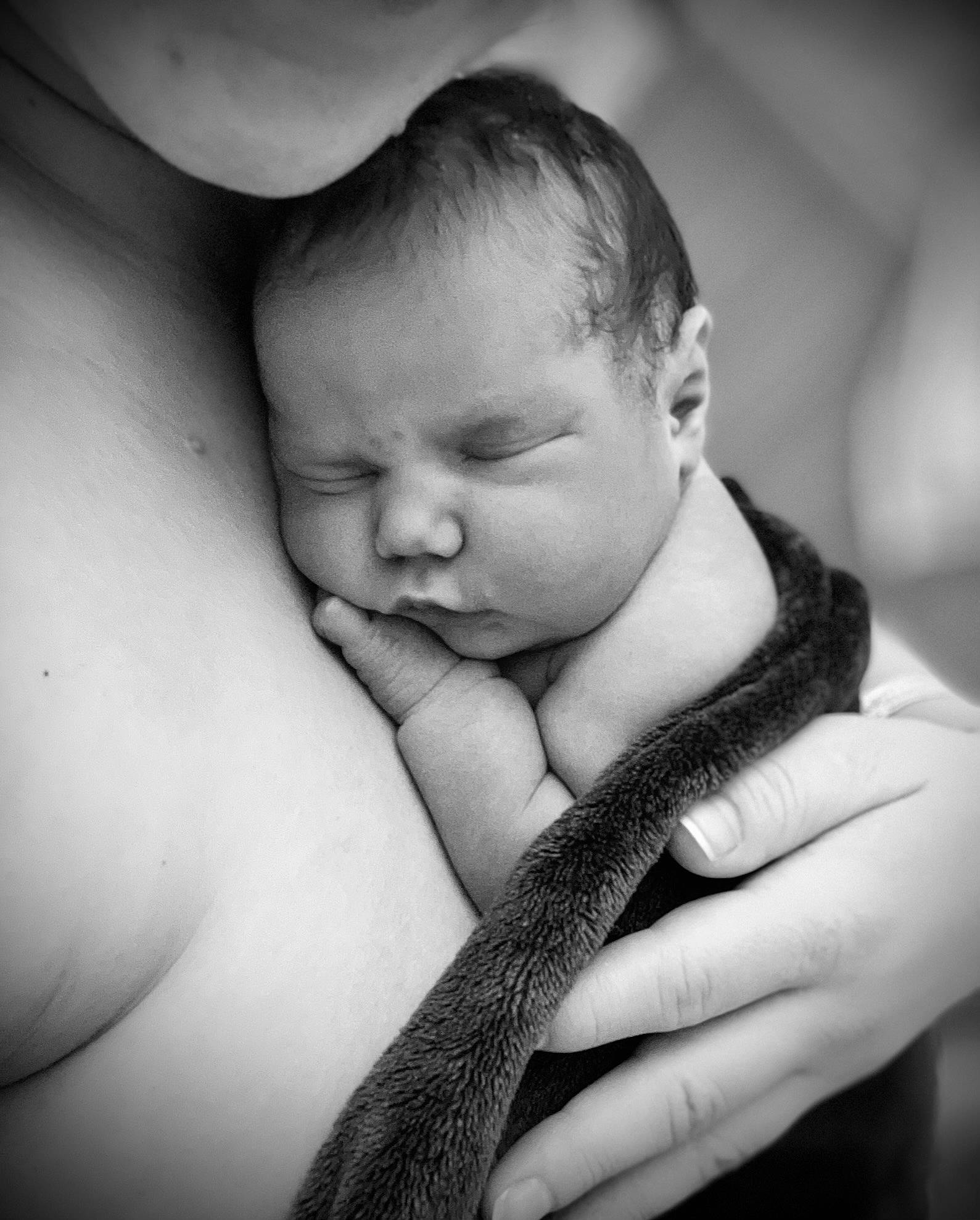 Mckenna is registered to the contest to win money with this photo: arm, baby, black, black_and_white, cloud, comfort, elbow, eyelash, finger, flash_photography, gesture, hand, happy, head, interaction, lip, person, skin, style, toddler