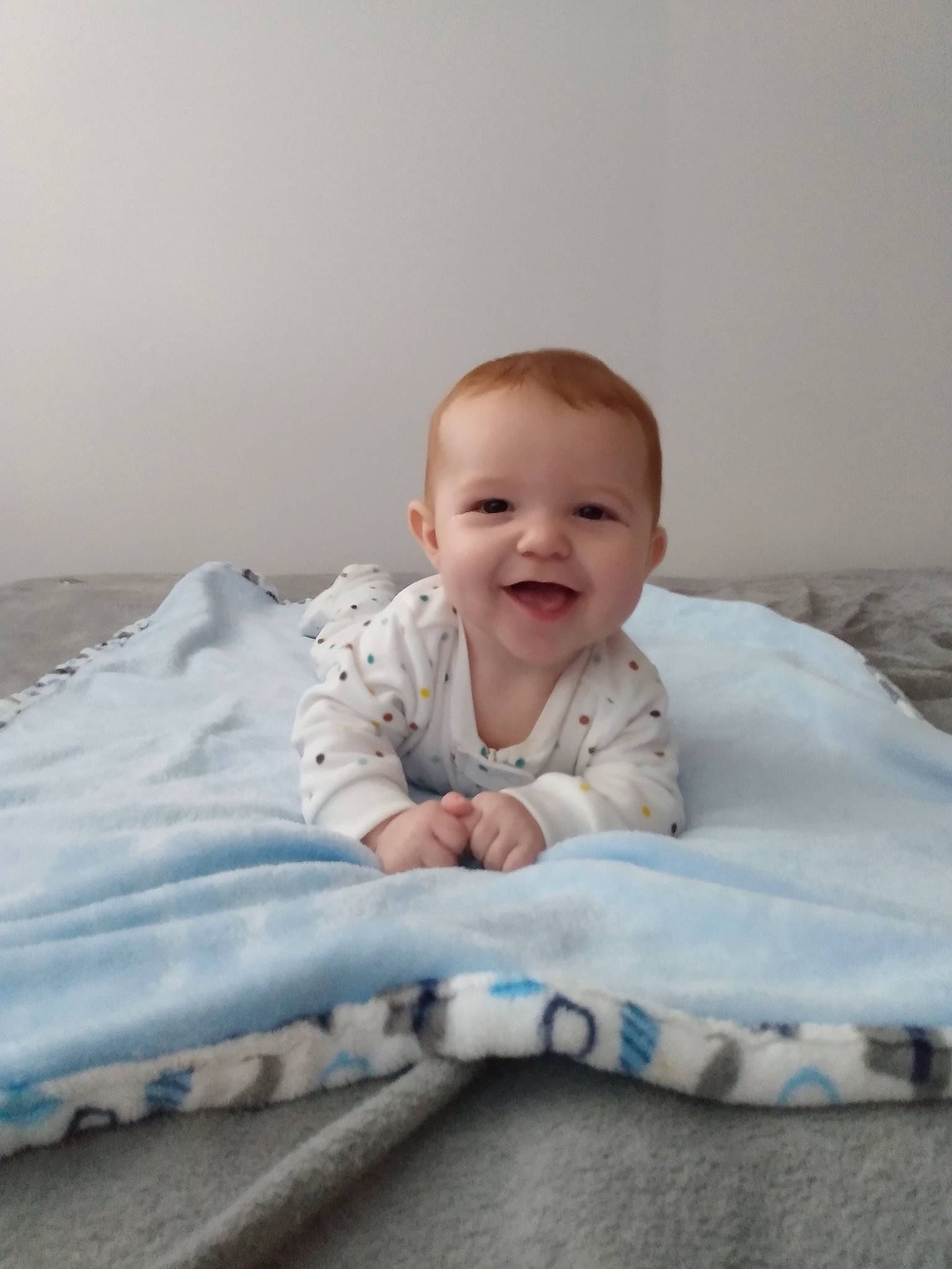 Bryant is registered to the contest to win money with this photo: baby, baby_laughing, baby_toddler_clothing, cheek, child, comfort, eye, face, human, joy, linens, nose, person, photo_shoot, portrait_photography, skin, toddler