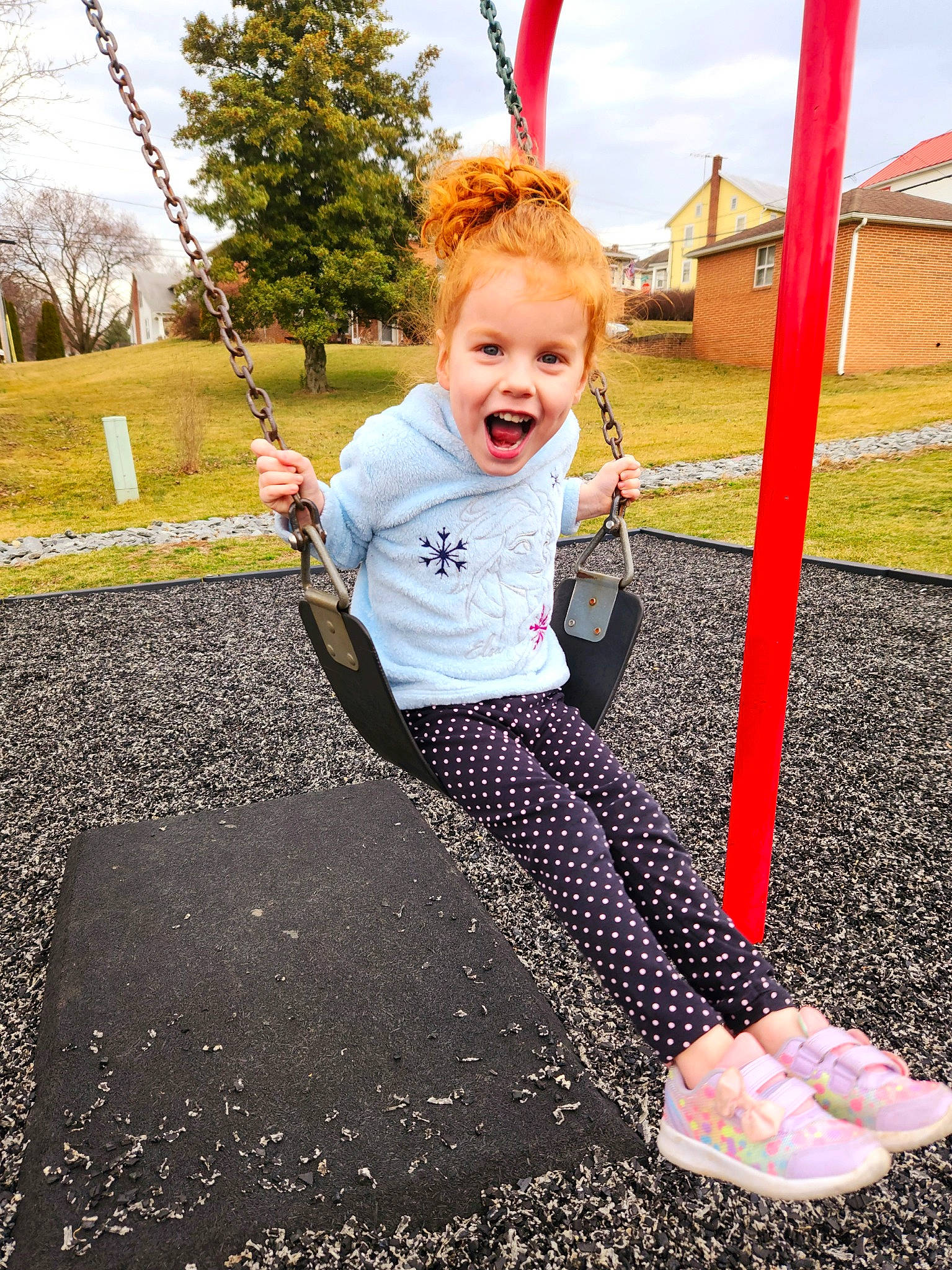 Maelee joined the competition — help win amazing prizes! asphalt, child, city, fun, grass, happy, leisure, outdoor_play_equipment, people_in_nature, person, plant, playground, public_space, recreation, road_surface, sky, smile, soil, swing, toddler
