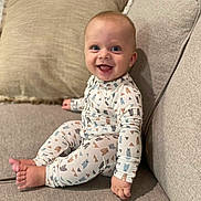 Elijah joined the competition — help win amazing prizes! baby, babylaughing, clothing, cushion, face, happy, head, homedecor, pajamas, pants, person, photography, portrait, sitting, sleeve, smile
