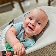 Hayde joined the competition — help win amazing prizes! baby, infant, smile, happy, child, toy, seated, indoor, closeup, face, skin, hand, clothing, baby_seat, playtime, cute, young, expression, person, home