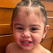 Jael'Izahk joined the competition — help win amazing prizes! toddler, child, smiling, face, hair, braids, earrings, teeth, skin, portrait, indoor, cabinet, wood, happy, cute, person, baby, expression, closeup, head