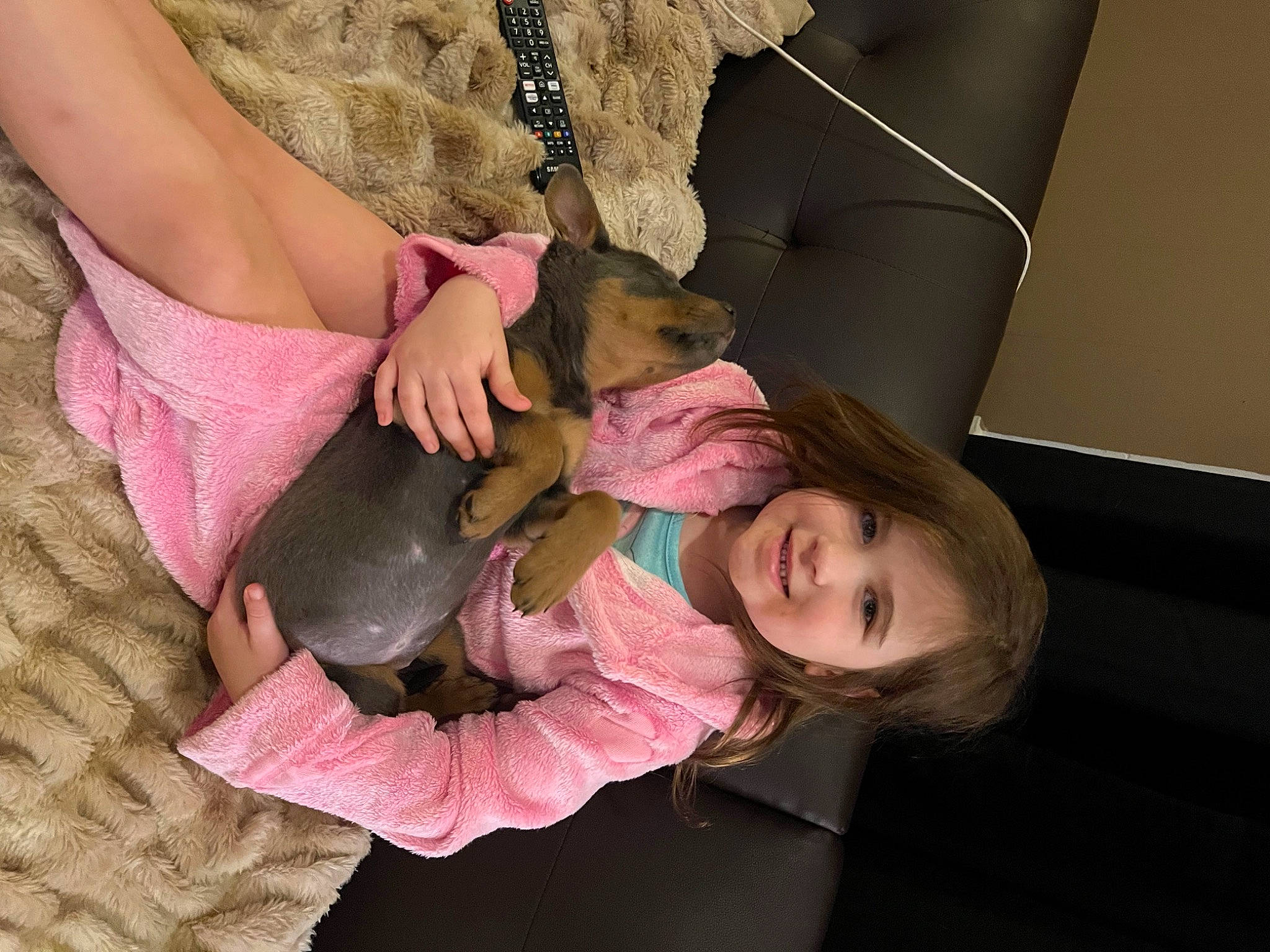 Zuri is registered to the contest to win money with this photo: baby, child, comfort, ear, eyelash, foot, fun, gesture, happy, human_body, human_leg, joy, lap, leisure, nail, person, sitting, skin, smile, thigh