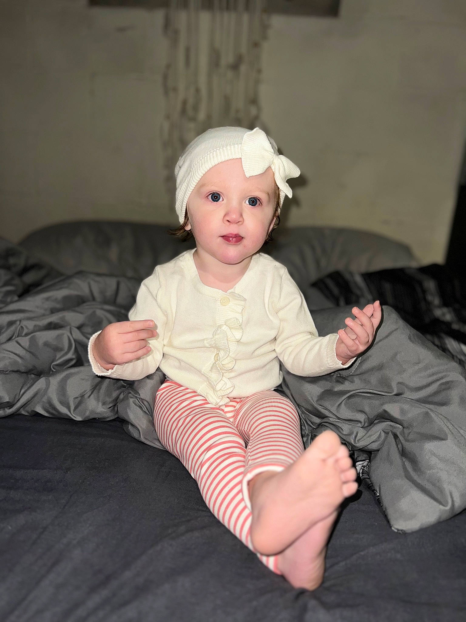Kyla joined the competition — help win amazing prizes! baby, baby_toddler_clothing, cheek, child, comfort, couch, darkness, fashion_accessory, flash_photography, flooring, foot, fun, headwear, human_leg, knee, lap, person, room, sitting, sleeve