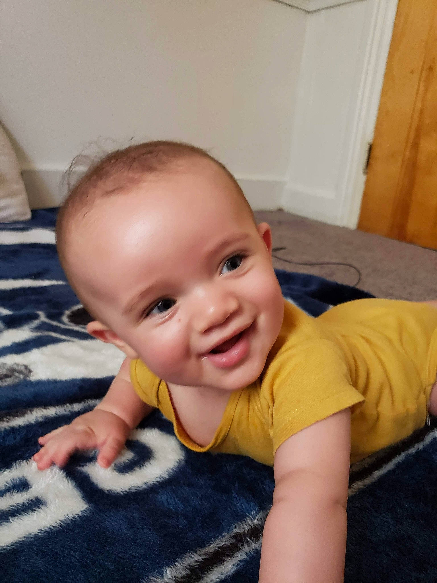 Sunni is registered to the contest to win money with this photo: baby, cheek, child, crawling, face, head, joy, nose, person, skin, smile, toddler, tummy_time