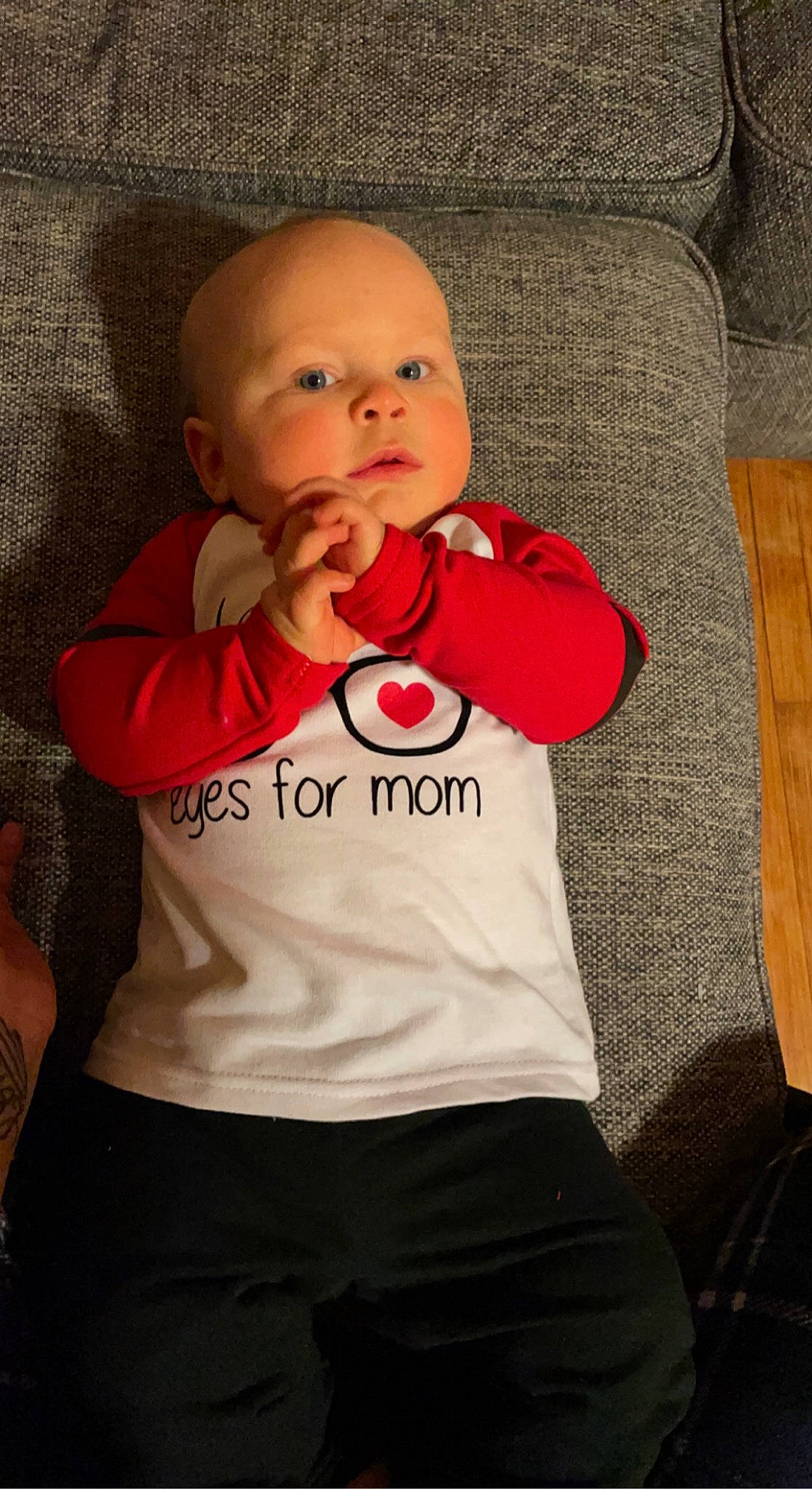 Lochlan is registered to the contest to win money with this photo: baby, baby_toddler_clothing, cheek, clothing, comfort, couch, eye, face, gesture, happy, head, iris, lip, mouth, nose, person, skin, sleeve, t_shirt, textile
